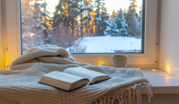 Soft winter light through a window, reflecting the quiet mood of the colder months