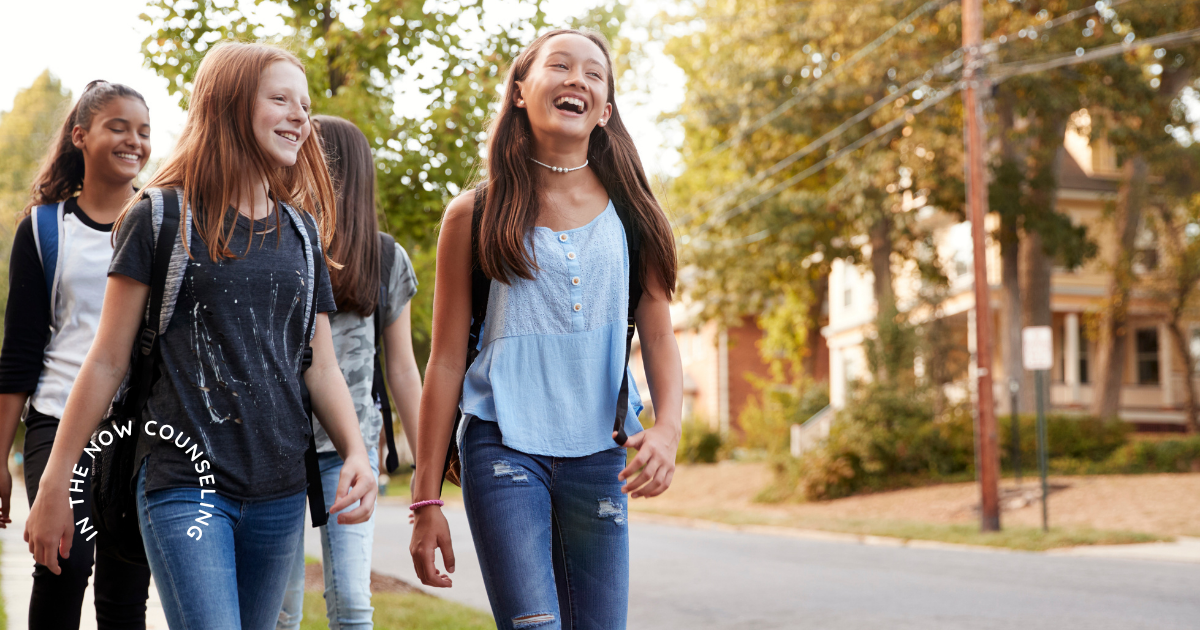 tweens walking to school smiling as they go back-to-school transition