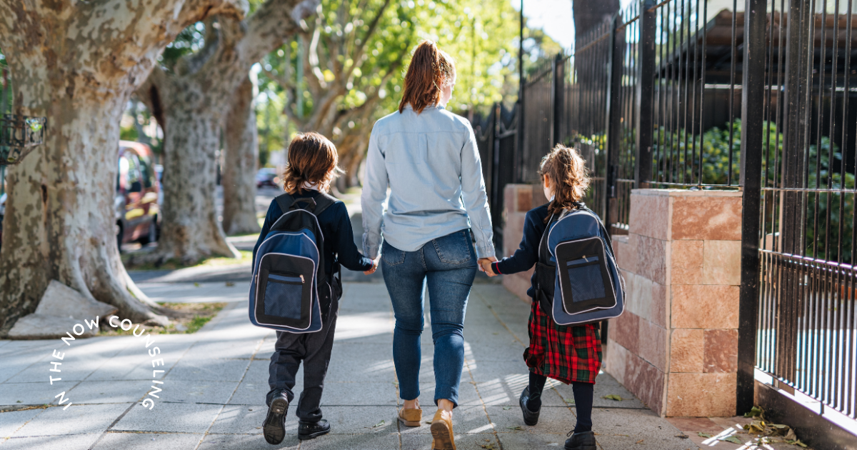 mom walking her kids home from school wondering why her child may be more emotional after starting school